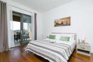 Postel nebo postele na pokoji v ubytování Spada Residence I