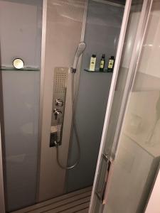 a shower with a phone in a bathroom at Viktoria Lodge Bed and Breakfast in Vodice +54 photos