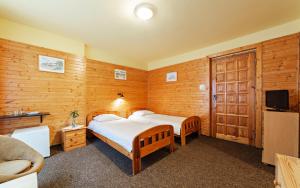 Ένα ή περισσότερα κρεβάτια σε δωμάτιο στο Willa Alaska