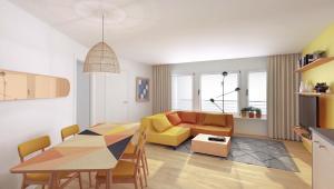 ein Wohnzimmer mit einem Tisch und einem gelben Sofa in der Unterkunft GAMA Home in Freiburg im Üechtland