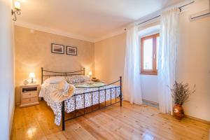 Postel nebo postele na pokoji v ubytování House nona Roza