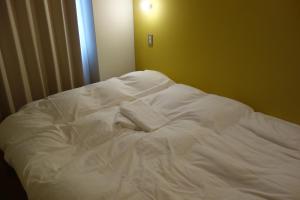 Ліжко або ліжка в номері Tomarotto Hostel