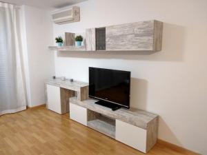 a living room with a flat screen tv on a wall at La caseta de Balaguer in Balaguer