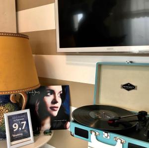 a desk with a cd and a picture and a lamp at Le Terrazze in Otranto