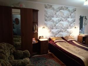 מיטה או מיטות בחדר ב-Apartment on Kuybysheva 59
