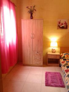 Postel nebo postele na pokoji v ubytování Apartment With Pool Gozo