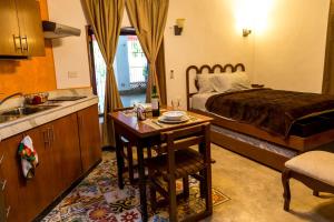 Kuchyň nebo kuchyňský kout v ubytování Merida Serviced Apartments