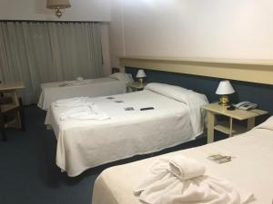 Una cama o camas en una habitación de Hotel Coliseo