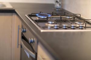 a stove top oven sitting in a kitchen at Kings Cross Apartments in London
