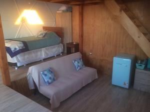 Ένα ή περισσότερα κρεβάτια σε δωμάτιο στο Kunza Kamanchacos