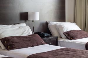 Cama ou camas em um quarto em View Hotel BRC