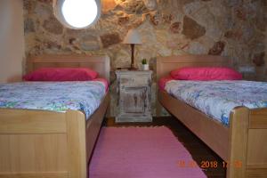 Postel nebo postele na pokoji v ubytování Rumpis Traditional House