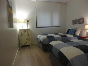 Katil atau katil-katil dalam bilik di Oporto Like Home II