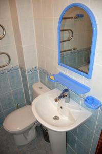 a bathroom with a sink and a toilet at Sanatoriy Zhosaly in Qarqaraly +38 photos