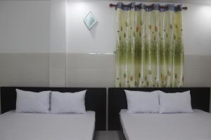 Postel nebo postele na pokoji v ubytování HaiVan HosTel