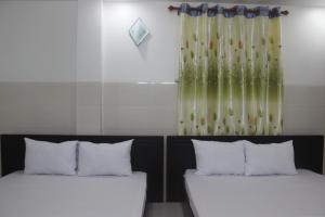 Giường trong phòng chung tại HaiVan HosTel