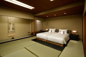 
A bed or beds in a room at Grand Prince Hotel Takanawa Hanakohro
