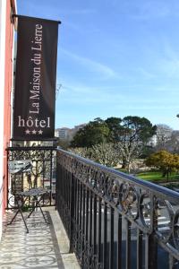 a sign on a balcony of a hotel at Hôtel & Espace Bien-être La Maison du Lierre in Biarritz