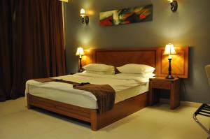 Ένα ή περισσότερα κρεβάτια σε δωμάτιο στο La Rosa Hotel By Brother International