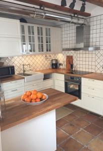 a kitchen with a bowl of oranges on a counter at Cozy Townhouse Altea in Altea