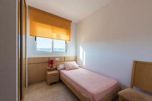 Postel nebo postele na pokoji v ubytování Apartamentos Jardines del Mar II