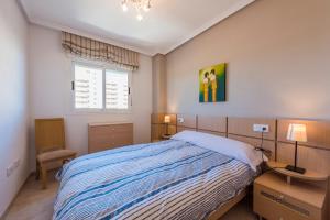 Postel nebo postele na pokoji v ubytování Apartamentos Jardines del Mar II