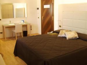 Voodi või voodid majutusasutuse Hotel Alexander toas