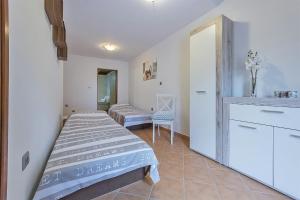 Postel nebo postele na pokoji v ubytování Apartments Monte Grande