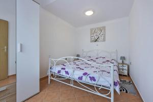 Postel nebo postele na pokoji v ubytování Apartments Monte Grande