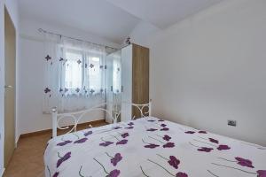 Postel nebo postele na pokoji v ubytování Apartments Monte Grande