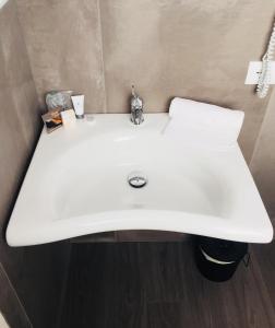 Koupelna v ubytování Pove 2.4 Hotel