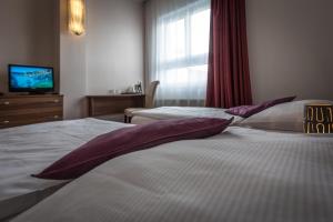 Postel nebo postele na pokoji v ubytování Sareza hotel