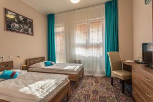 Postel nebo postele na pokoji v ubytování Sareza hotel