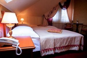 Posteľ alebo postele v izbe v ubytovaní Hotel Elefant