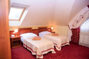 Posteľ alebo postele v izbe v ubytovaní Hotel Elefant
