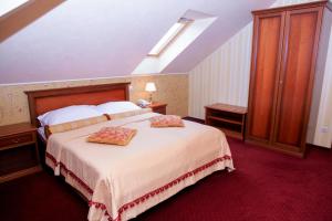 Posteľ alebo postele v izbe v ubytovaní Hotel Elefant