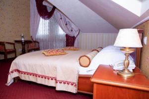 Posteľ alebo postele v izbe v ubytovaní Hotel Elefant