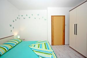 Postel nebo postele na pokoji v ubytování Apartman Diana