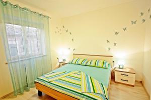 Postel nebo postele na pokoji v ubytování Apartman Diana