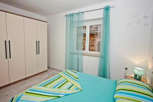 Postel nebo postele na pokoji v ubytování Apartman Diana