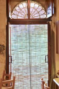 a window in a room with a view of the water at Xemx in Qala
