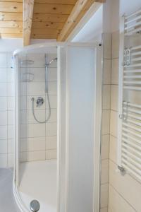 a shower with a glass door in a bathroom at donadelmar2 in Riomaggiore