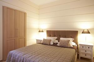 Кровать или кровати в номере Elaion mini suites