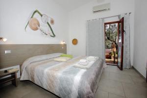 Postel nebo postele na pokoji v ubytování B&B Campu Moru