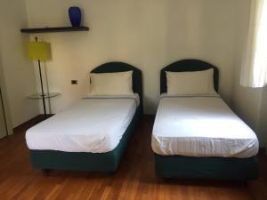 Posteľ alebo postele v izbe v ubytovaní La Villa Del Cedro