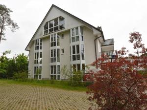 a large white building with a lot of windows at Ferienwohnung-8-3 in Baabe