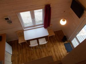 an overhead view of a room with chairs and a window at Bałtyckie Siedlisko in Jarosławiec