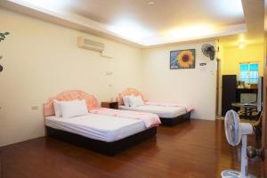 Ліжко або ліжка в номері Chin Shan B&B