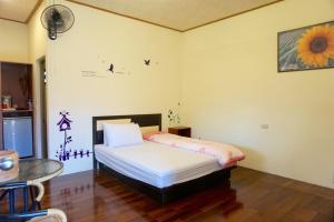 Ліжко або ліжка в номері Chin Shan B&B