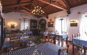 a restaurant with blue and white tables and chairs at Quinta De Santana in Rabo de Peixe